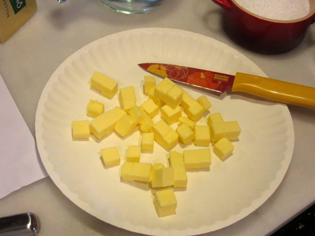 Cubed butter on a paper plate.