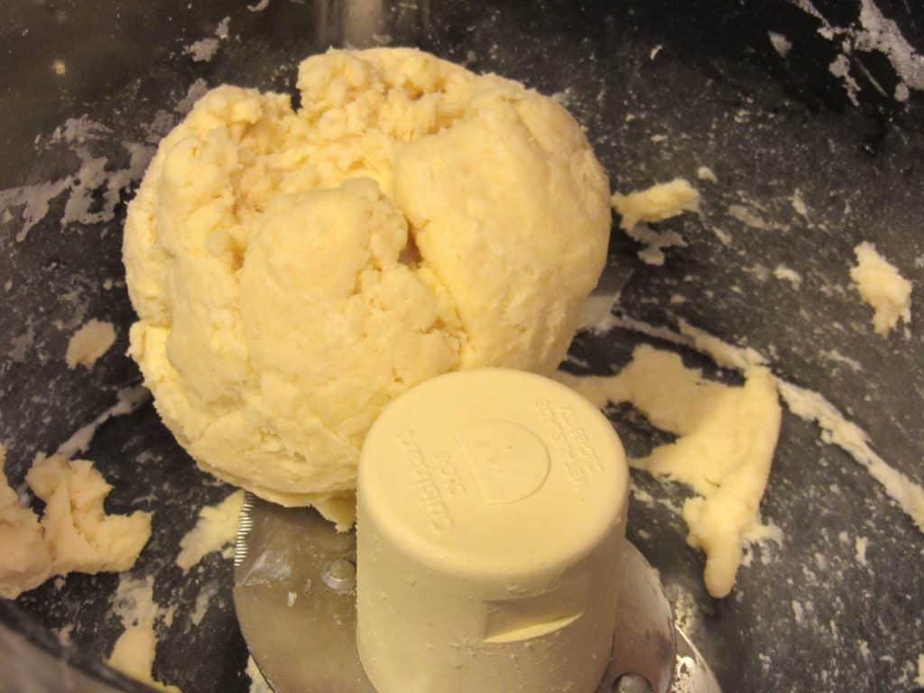 A ball of tart dough in a food processor.