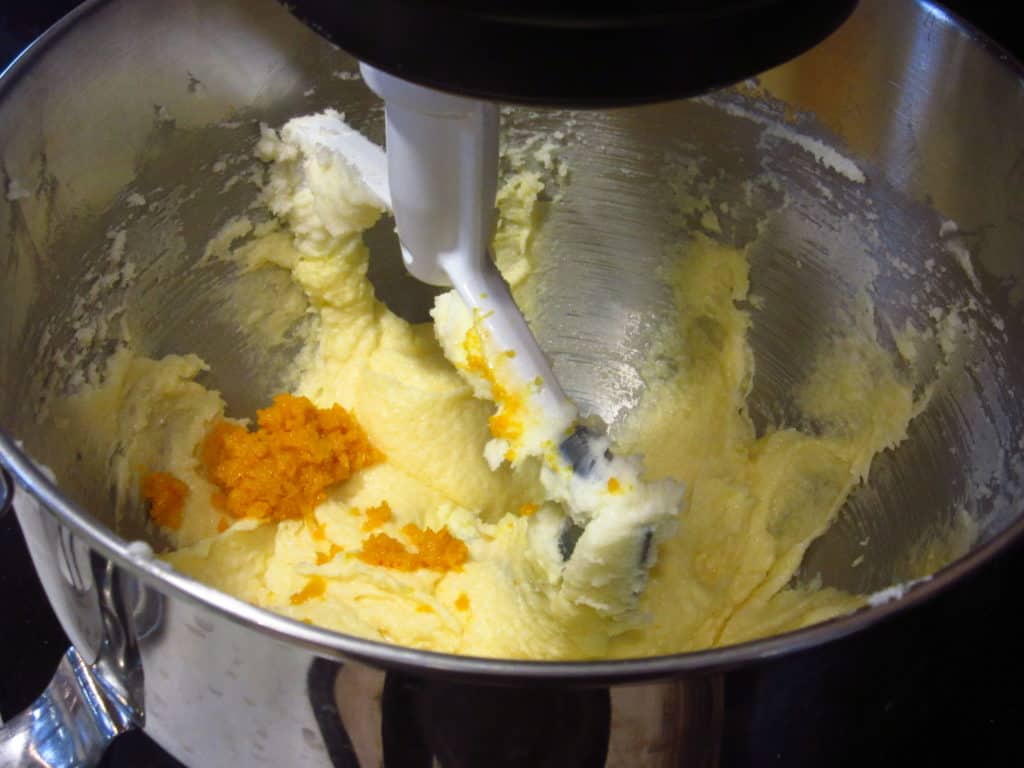 Orange zest in a bowl of butter for a cookie batter.