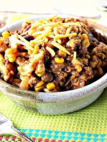A heaping serving of Slow Cooker Chili Mac in a rustic bowl.