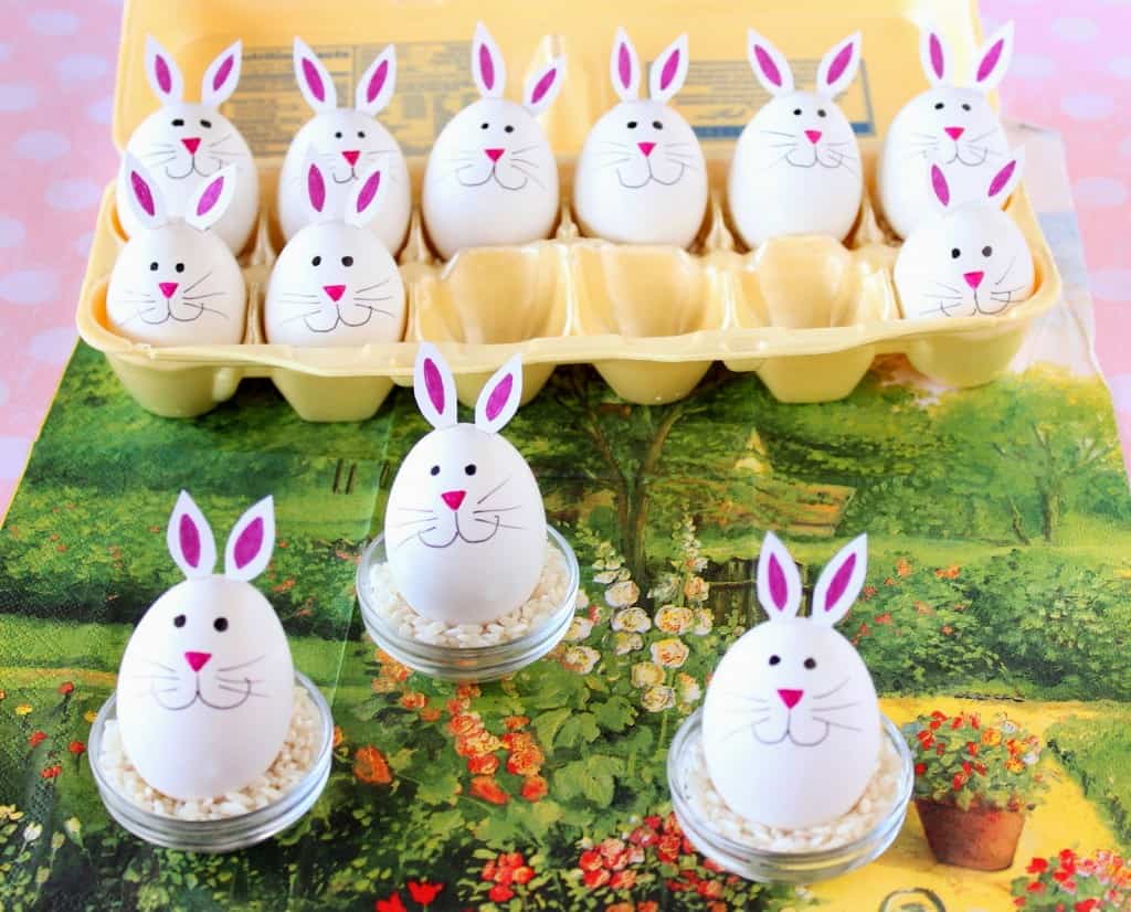 Super cute hard-boiled bunny eggs on a colorful garden themed napkin.