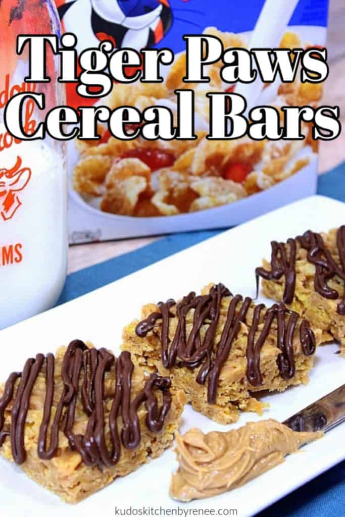 Closeup title text image of no-bake tiger paws cereal bars with a knife and peanut butter and a glass container of milk in the background.