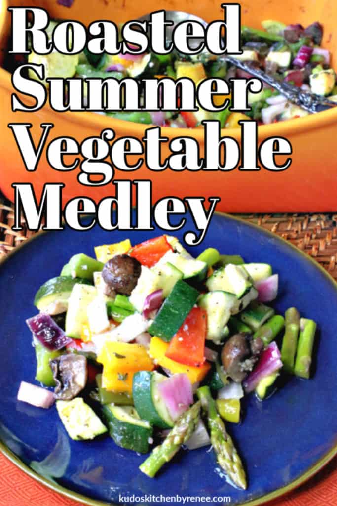 A closeup photo of delicious and colorful roasted summer vegetable medley on a blue plate with a casserole dish in the background.
