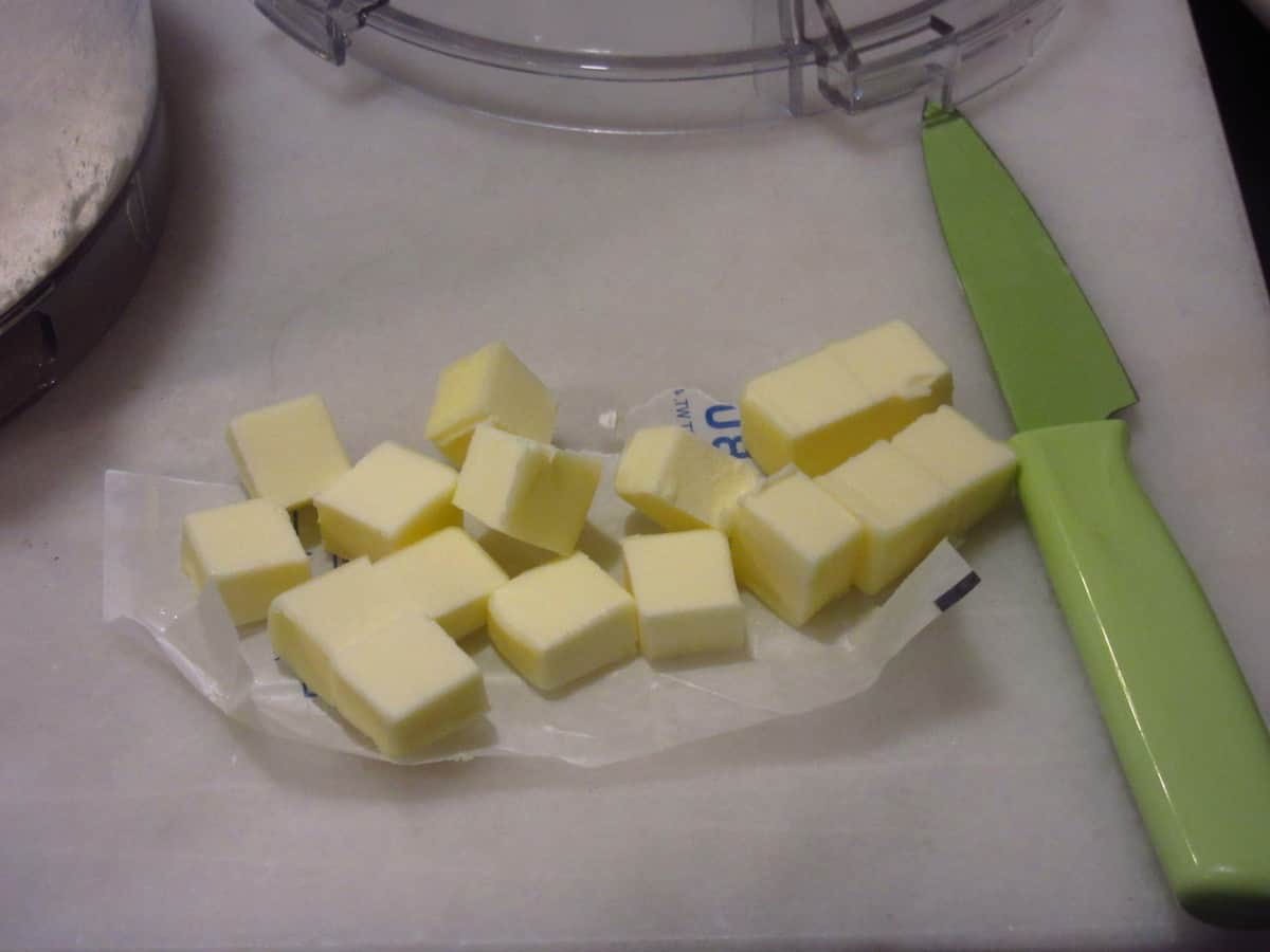 Diced butter with a paring knife.