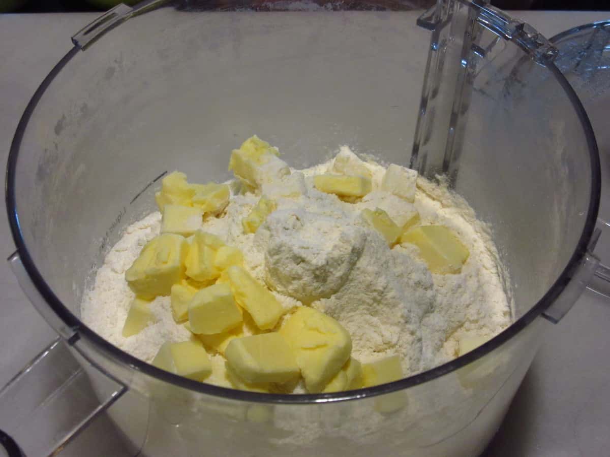Butter and flour in a food processor for making pie dough.
