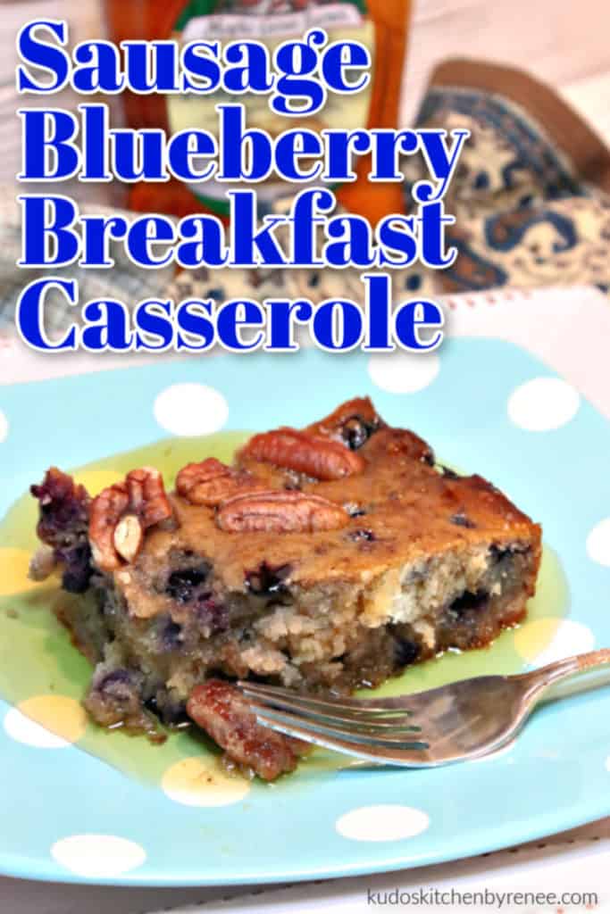 A vertical title text overlay graphic for a slice of sausage blueberry breakfast casserole on a blue polka dot plate