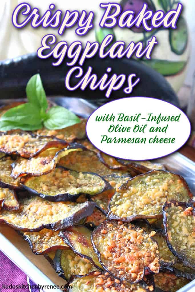 A vertical image of crispy baked eggplant chips on a small baking tray with a whole eggplant in the background and a title text overlay graphic in purple and white