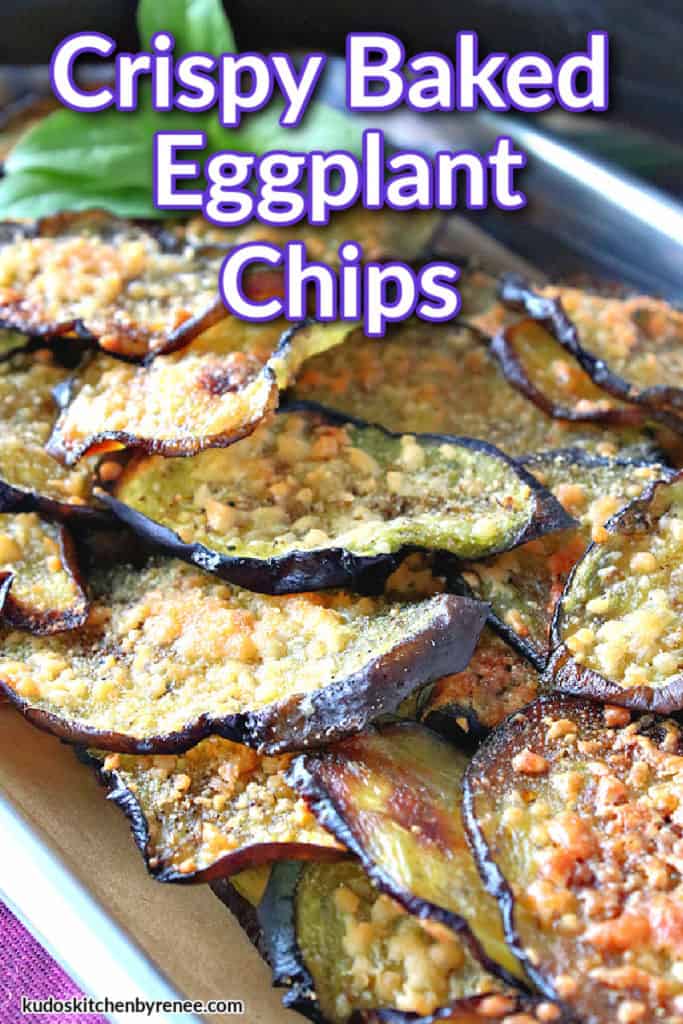 A vertical closeup of a small baking tray piled high with crispy baked eggplant chips and a title text overlay graphic in purple and white.