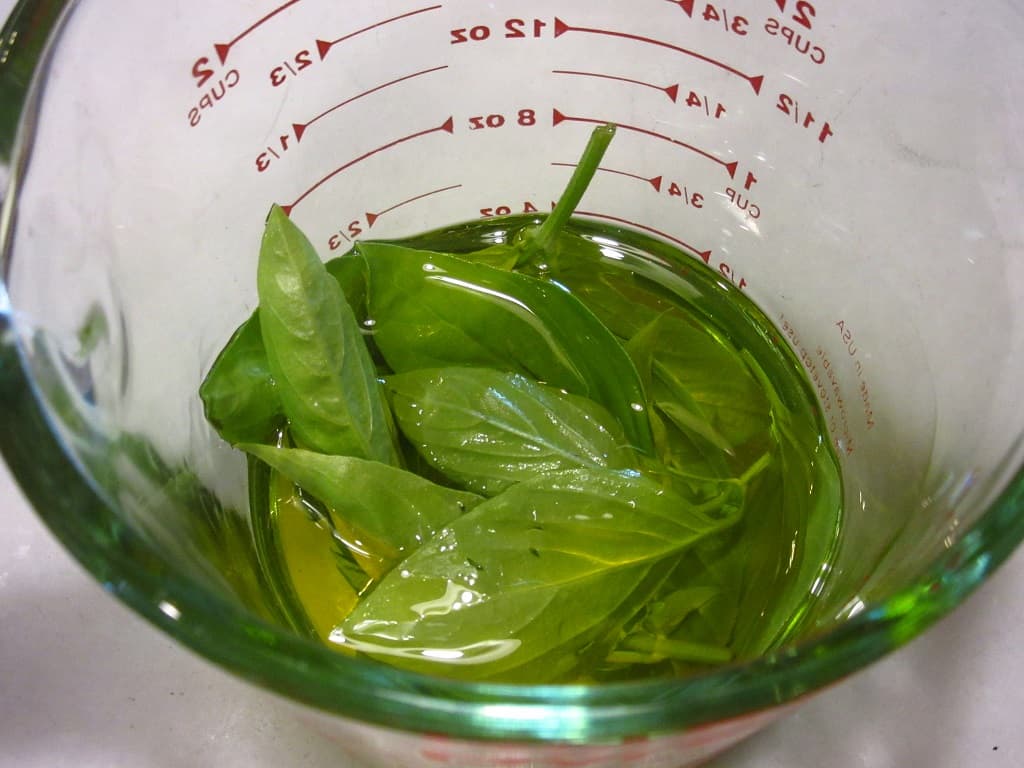 Wilted basil leaves in olive oil.