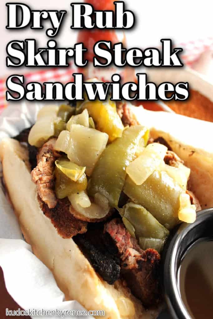 A closeup vertical photo of a dry rub skirt steak sandwich with onions and peppers along with a title text overlay graphic