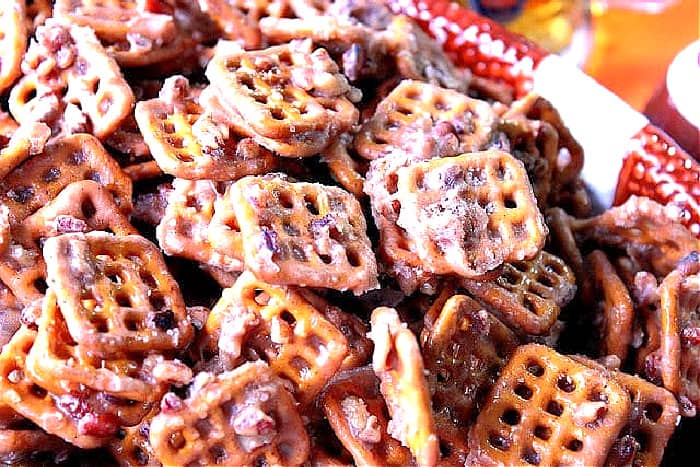 A closeup photo of Cinnamon Praline Pretzels with a brown sugar and pecan coating