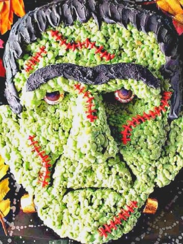 A green Frankenstein Rice Krispie treat with stitches and real looking eyeballs.