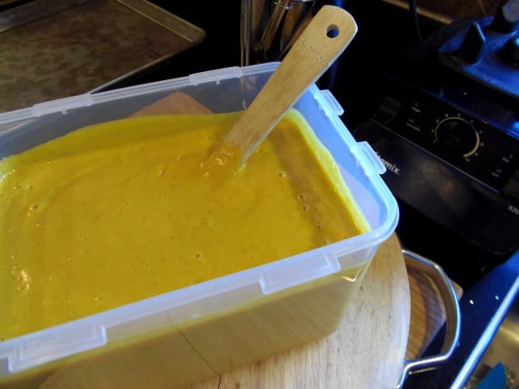 Golden cream soup in a container.