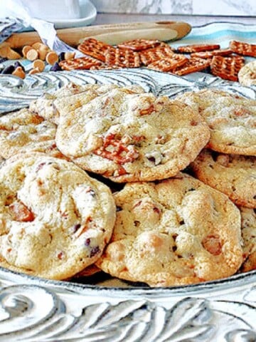 A pretty platter filled with Take 5 Cookies with pretzels in the background.
