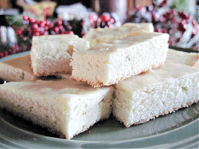 A closeup horizontal photo of plate of sliced Anise Cookies