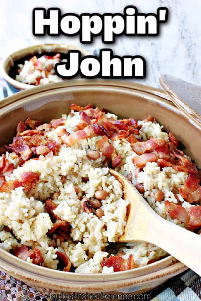 A vertical closeup photo of a casserole dish filled with Hoppin' John along with a wooden spoon dishing out a serving.