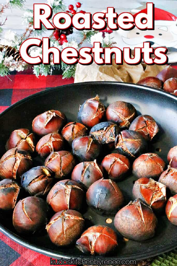 A vertical closeup photo of Roasted Chestnuts in a chestnut roasting pan with a title text overlay graphic in red, white, and black.