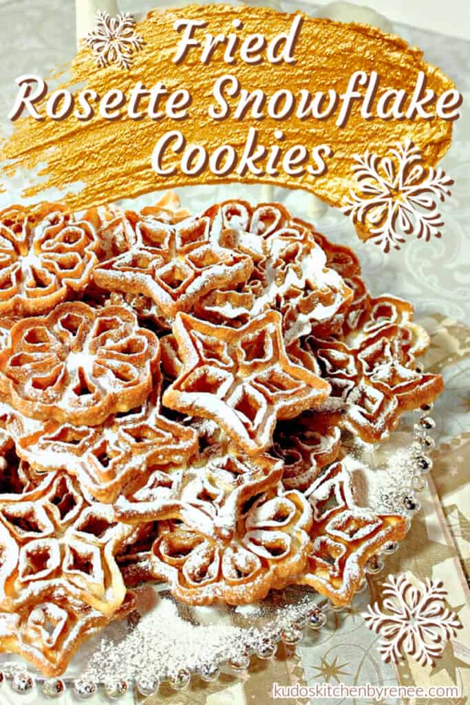 Vertical closeup image of Rosette Snowflake Cookies with confectioners sugar dusting and a title text overlay image in gold and white.