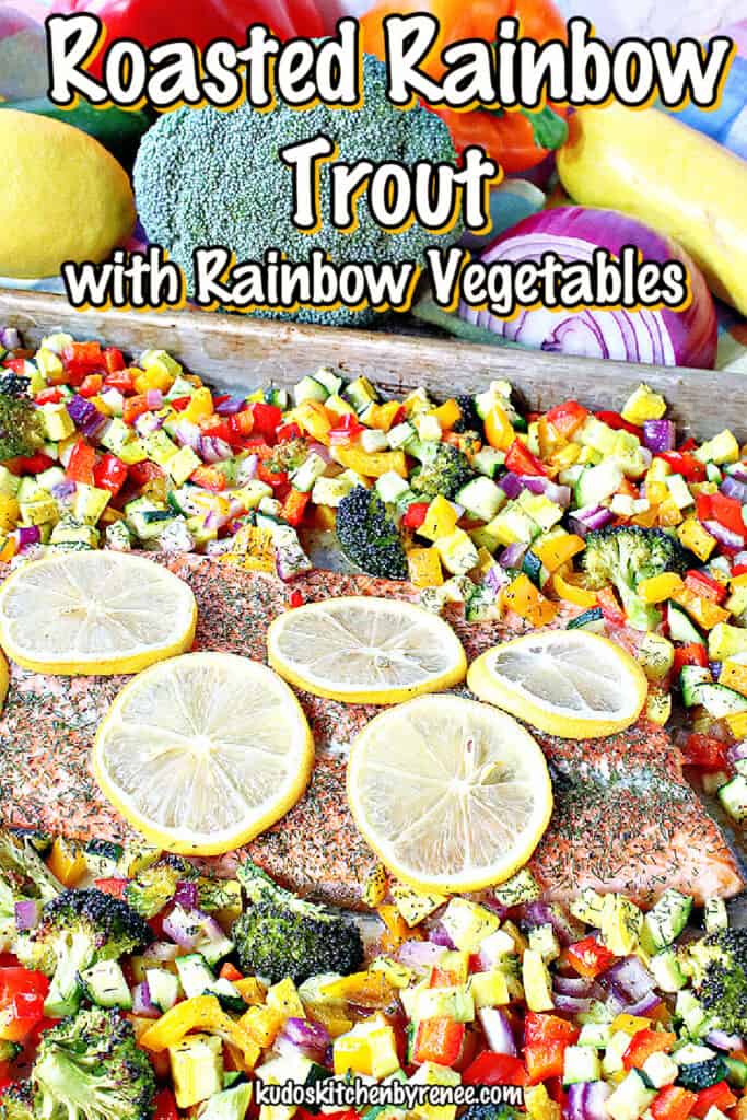 A vertical closeup of a colorful Roasted Rainbow Trout surrounded by rainbow vegetables along with a title text overlay graphic.