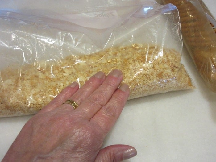 Crushed ritz crackers in a zip top bag.
