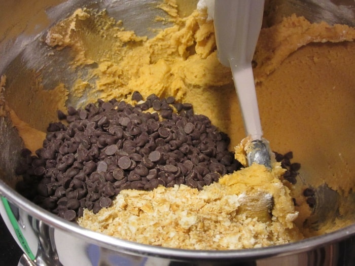 Chocolate chips added to a cookie dough batter.