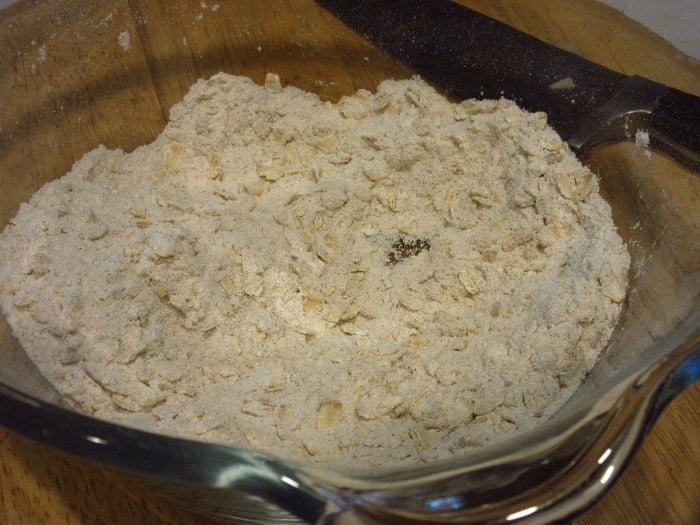 A streusel topping in a glass bowl.