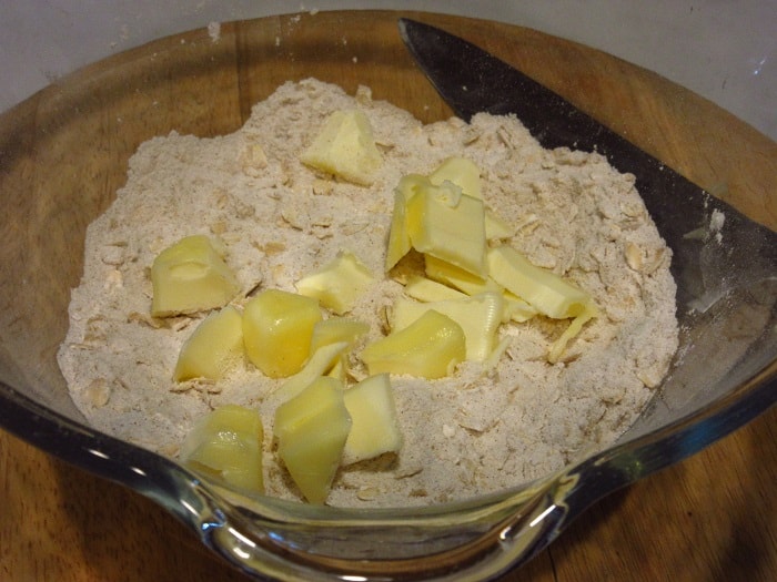 Butter added to a bowl to make a streusel topping.