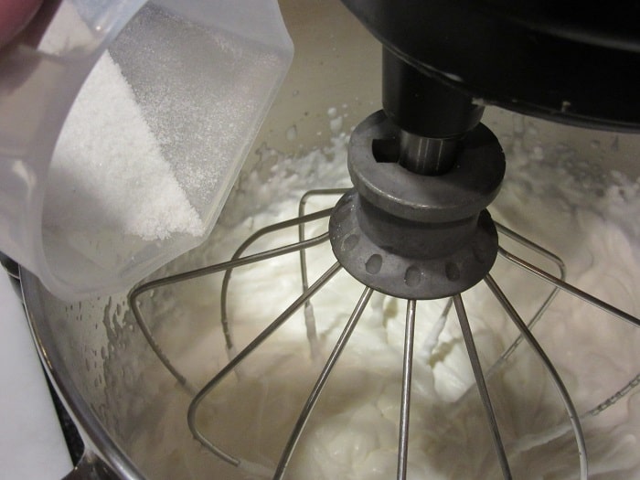 Making homemade whipped cream in a stand mixer.