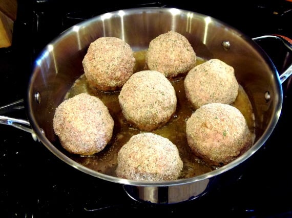 Breaded Scotch Eggs in a large skillet.