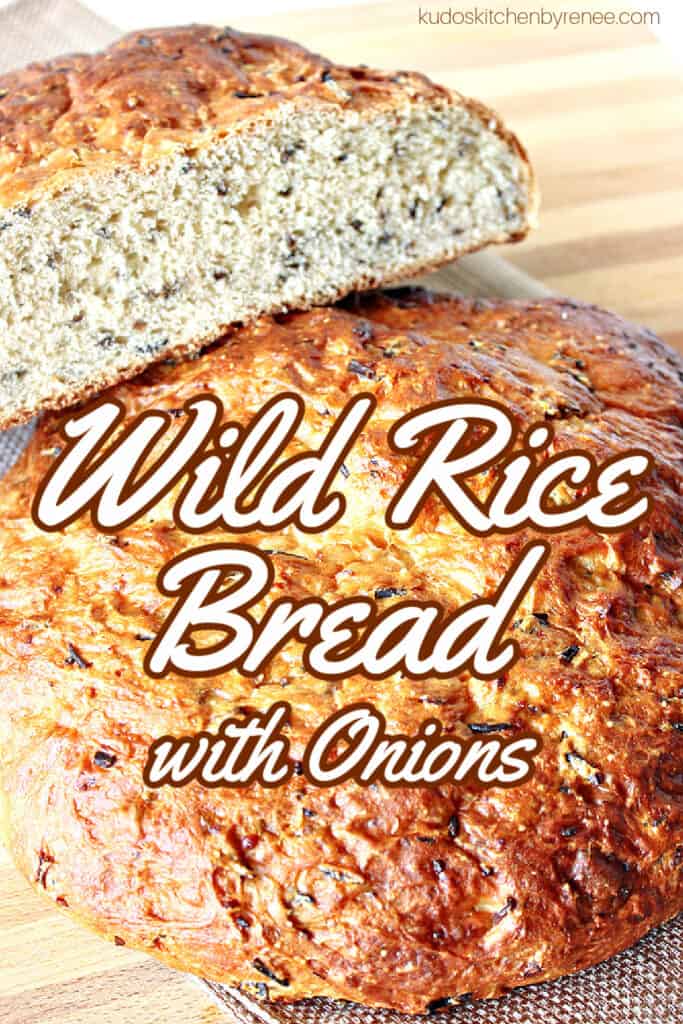 A vertical closeup of a golden brown round loaf of Wild Rice Bread with Onions and a title text overlay graphic in the center.
