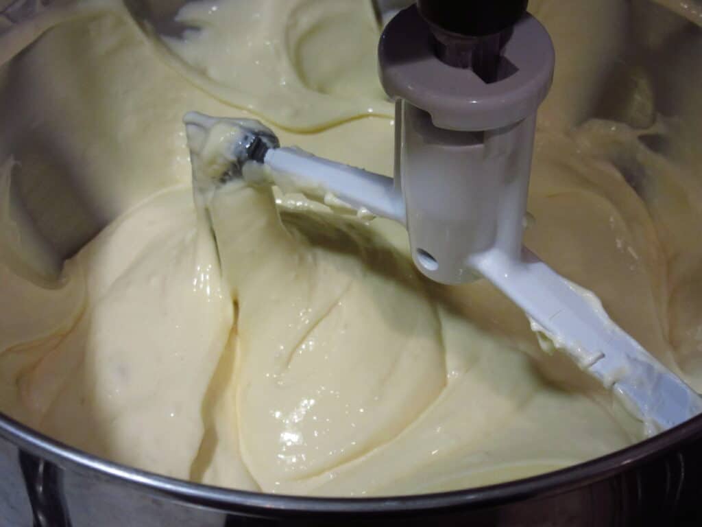 Creamy cheesecake batter in a stand mixer.