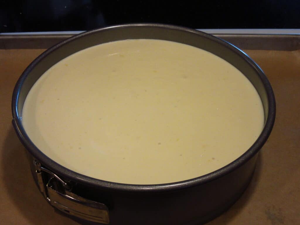 Cheesecake batter before baking in a pan.