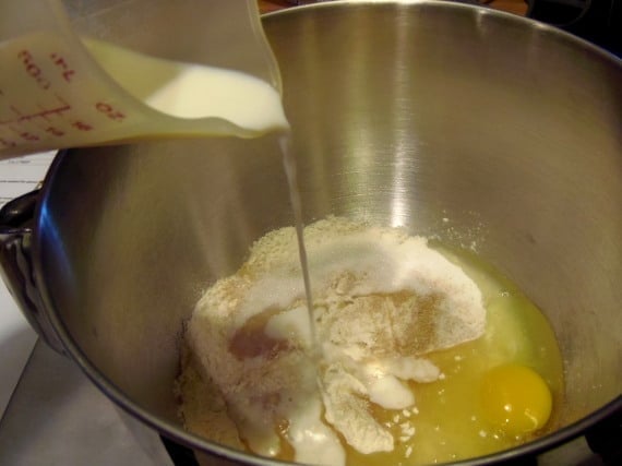 Milk being added to a mixing bowl.