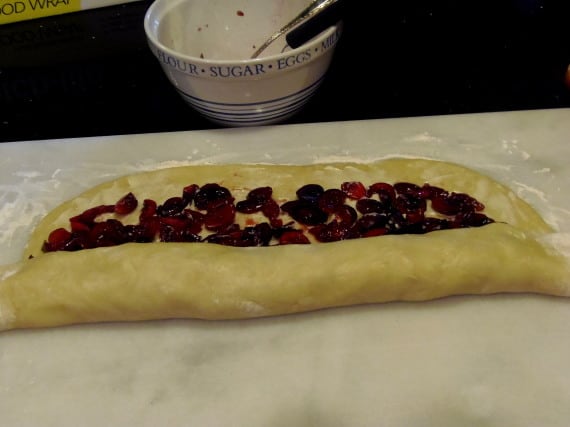Dough being rolled up for Cherry rolls.
