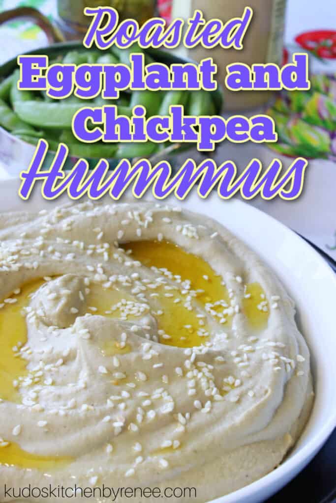 A vertical photo of a bowl of Eggplant and Chickpea Hummus with a title text overlay graphic in purple and cream colors.