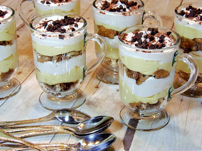 Six Skinny Tiramisu Parfaits in glass coffee mugs along with spoons.