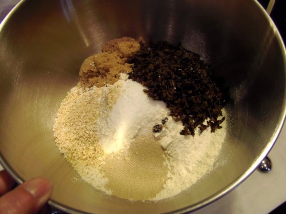 Ingredients for making wild rice bread in the bowl of a stand mixer.