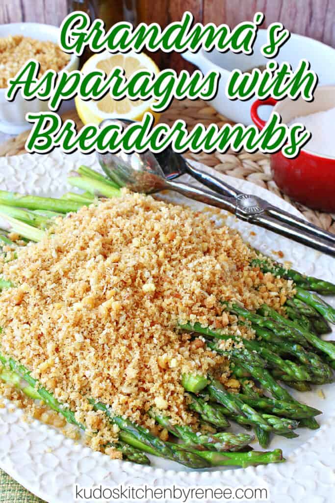 A vertical closeup photo along with a title text overlay graphic for Asparagus with Breadcrumbs with tongs on a white platter.