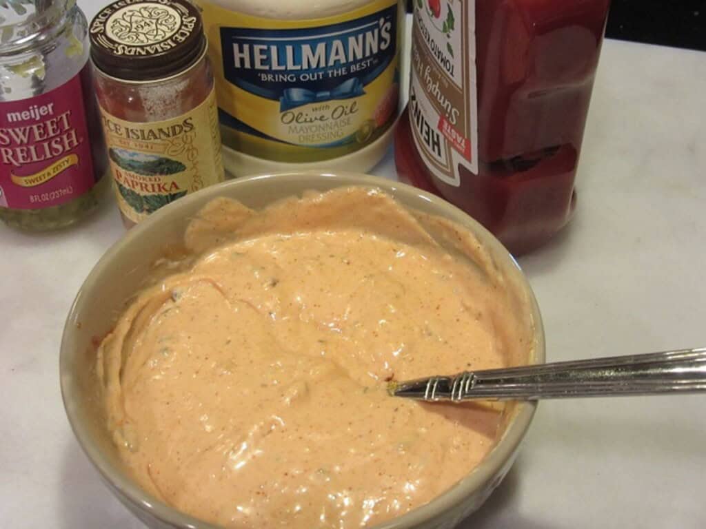 A homemade thousand island sauce in a bowl with a spoon.