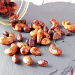 Brown Butter Roasted Nuts on a black slate tile.