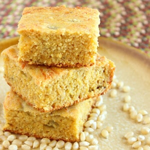 Three pieces of stacked Buttermilk Green Chili Cornbread on a plate.