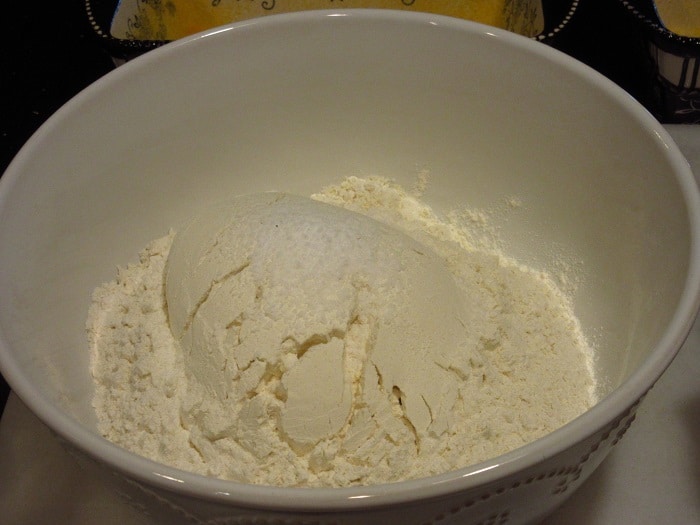 All-purpose flour in a white bowl.