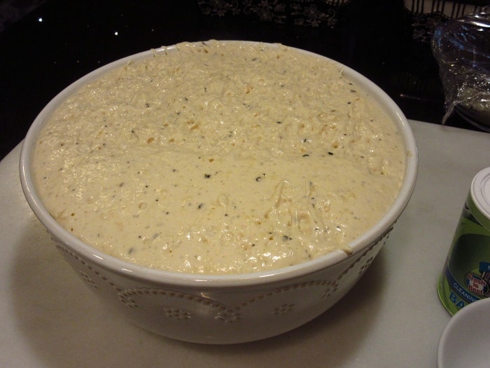 A risen bowl of Everything English Muffin Bread dough before baking.