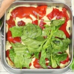 An Alfredo Ravioli Lasagna in a spring form pan.