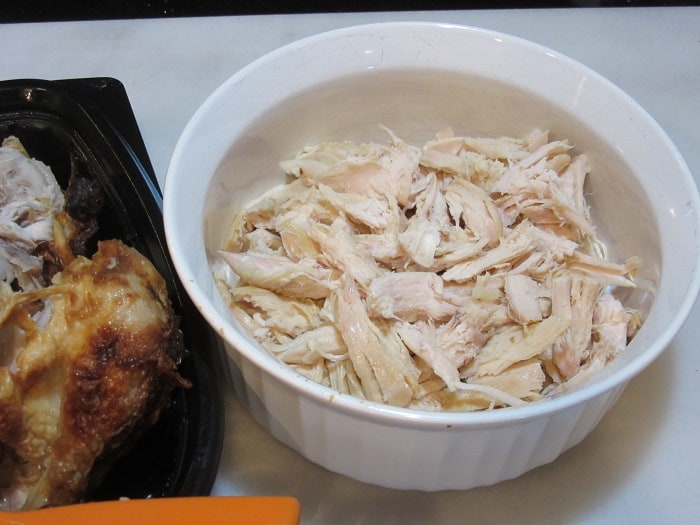 Shredded rotosserie chicken in a bowl.