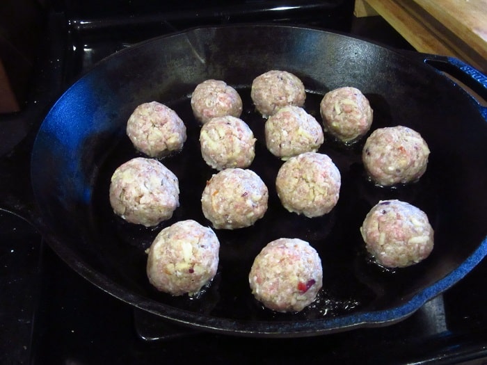 Meatballs in a cast iron skillet.