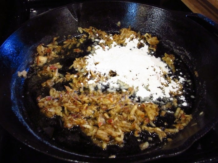 Browned grated apple and flour in a cast iron skillet.