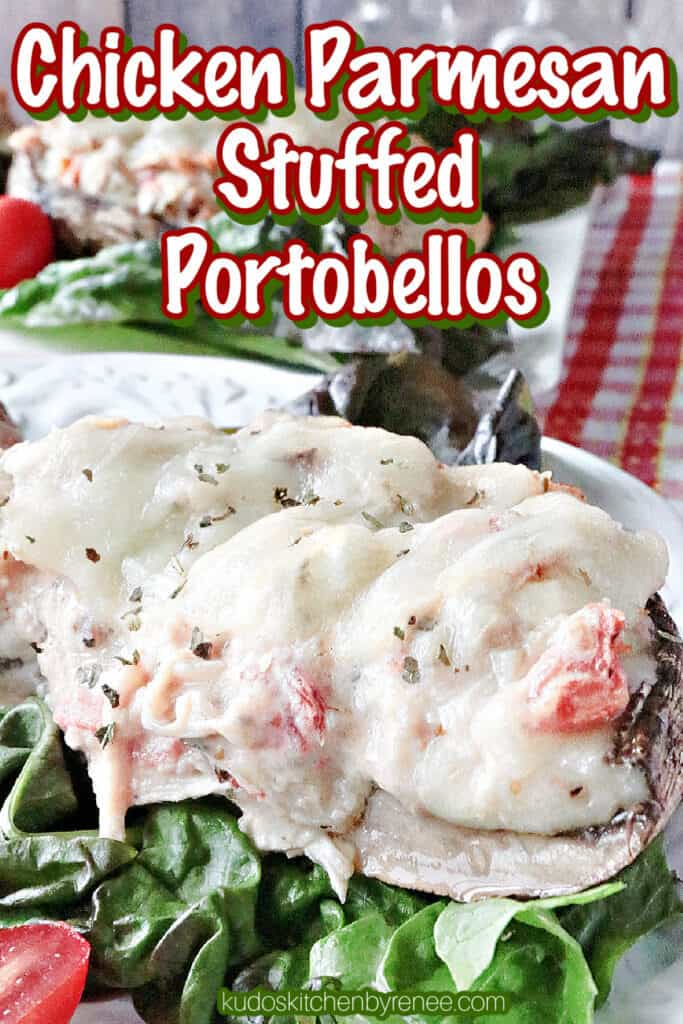 A vertical closeup of a cut in half Chicken Parmesan Stuffed Portobello mushroom with lettuce and tomato on a white plate. 