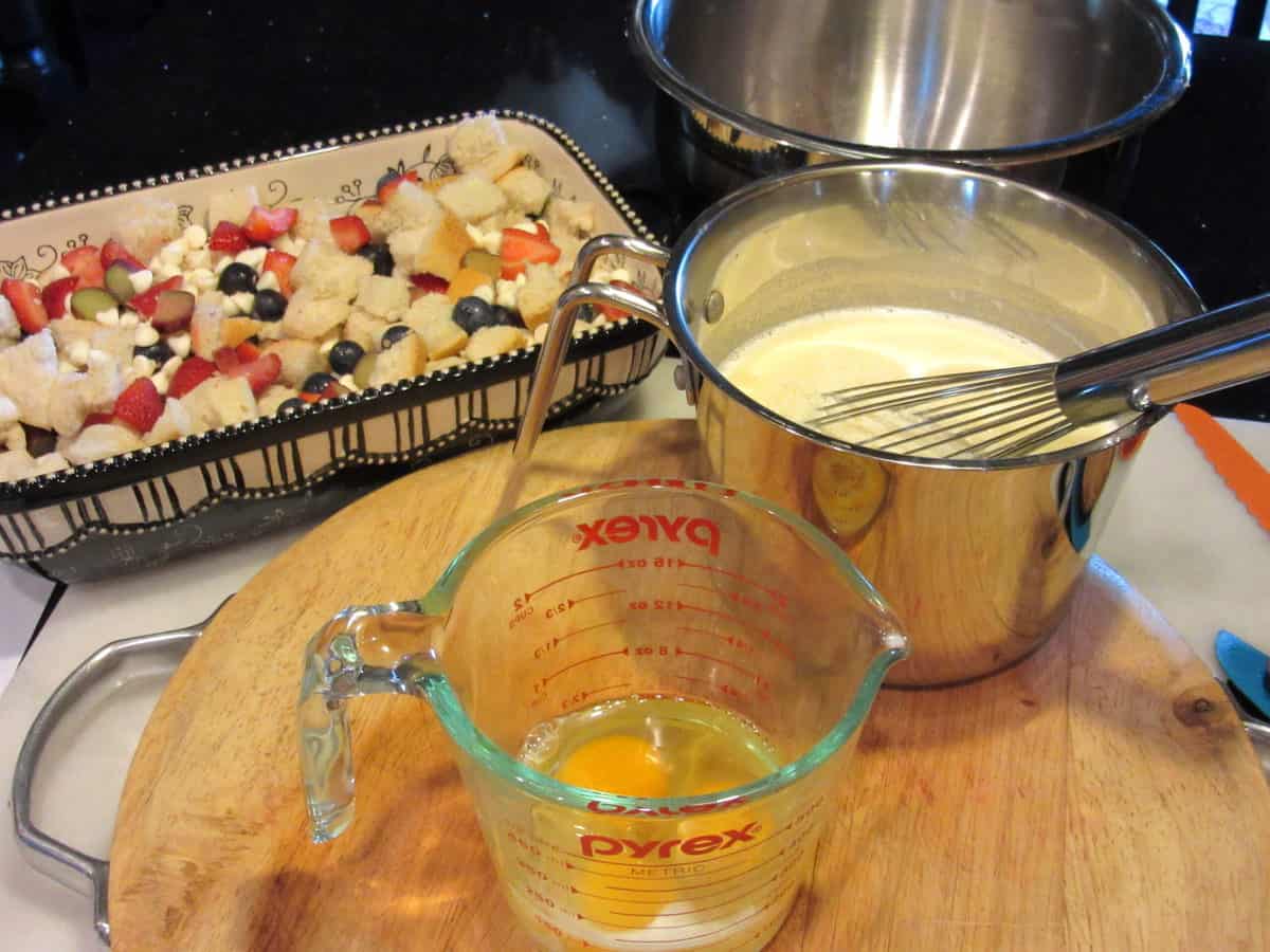 Eggs, milk, and bread pudding in the background.