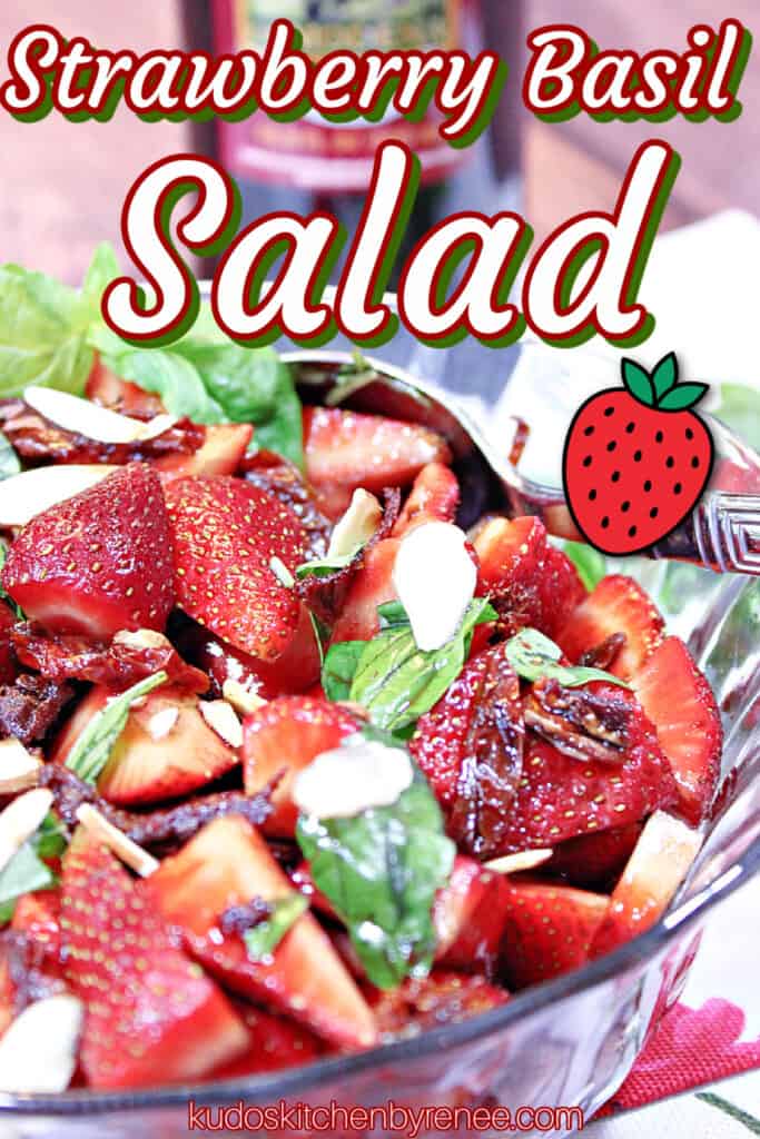 A vertical closeup image along with a title text overlay graphic for Strawberry Basil Salad with sun dried tomatoes and slivered almonds.